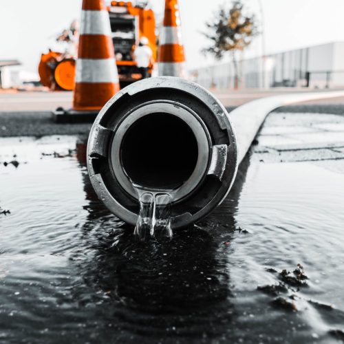 gray-pipe-with-water-coming-out-its-hole-min-scaled.jpg